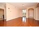 Open living room with hardwood floors and bathroom access at 12414 Baleria Cv # 108, Orlando, FL 32837