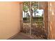 Private screened balcony overlooking lush landscaping at 12414 Baleria Cv # 108, Orlando, FL 32837