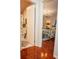 Hallway view of bedroom and bathroom with hardwood floors at 1296 Skyline Dr, Tavares, FL 32778