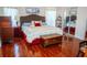 Spacious bedroom with king-size bed and mirrored closet doors at 1296 Skyline Dr, Tavares, FL 32778