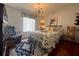 Charming bedroom with a queen-size bed and wood floors at 1296 Skyline Dr, Tavares, FL 32778
