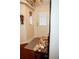 Bright entryway with wood floors and decorative bench at 1296 Skyline Dr, Tavares, FL 32778