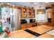 Kitchen with stainless steel appliances and wood cabinets at 1296 Skyline Dr, Tavares, FL 32778