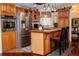 Spacious kitchen with stainless steel appliances and an island at 1296 Skyline Dr, Tavares, FL 32778