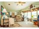 Bright and airy living room featuring ample natural light and comfortable furniture at 1296 Skyline Dr, Tavares, FL 32778