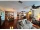 Open concept living room, kitchen and dining area with hardwood floors at 1296 Skyline Dr, Tavares, FL 32778