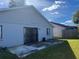 House backyard with patio and grassy area at 136 Pinewood Cir, Kissimmee, FL 34743