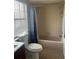 Bathroom with shower/tub combo, toilet, and vanity at 136 Pinewood Cir, Kissimmee, FL 34743