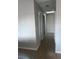 Clean hallway with light walls and tile floors at 136 Pinewood Cir, Kissimmee, FL 34743