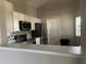 Kitchen with stainless steel appliances and white cabinets at 136 Pinewood Cir, Kissimmee, FL 34743