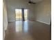 Spacious living room with tile floors and sliding doors at 136 Pinewood Cir, Kissimmee, FL 34743