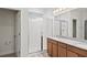 Bathroom with granite countertops, double sinks, and a walk-in shower at 14791 Crimson Bluff Aly, Winter Garden, FL 34787