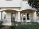 Front porch with double French doors and stone accents at 14791 Crimson Bluff Aly, Winter Garden, FL 34787