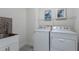 Laundry room with washer, dryer, and utility sink at 14791 Crimson Bluff Aly, Winter Garden, FL 34787