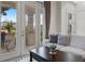 Bright living room with French doors leading to patio at 14791 Crimson Bluff Aly, Winter Garden, FL 34787