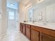 Double vanity bathroom with a walk-in shower at 1812 Sandy Park Trl, Kissimmee, FL 34747