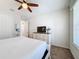 Cozy bedroom with a queen bed and dresser at 1812 Sandy Park Trl, Kissimmee, FL 34747