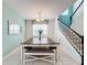 Bright dining room with a farmhouse table and bench seating at 1812 Sandy Park Trl, Kissimmee, FL 34747