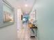 Bright entryway with light teal walls, a console table, and a mirror at 1812 Sandy Park Trl, Kissimmee, FL 34747