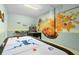 Game room featuring air hockey and beach mural at 1812 Sandy Park Trl, Kissimmee, FL 34747