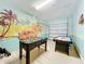 Game room with foosball, air hockey, and beach theme at 1812 Sandy Park Trl, Kissimmee, FL 34747
