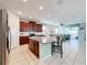 Open kitchen with granite island, stainless steel appliances, and ample cabinetry at 1812 Sandy Park Trl, Kissimmee, FL 34747