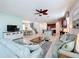 Spacious living room with an open floor plan, connecting to the kitchen and dining area at 1812 Sandy Park Trl, Kissimmee, FL 34747