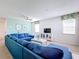 Bright living room featuring a comfortable sectional sofa and TV at 1812 Sandy Park Trl, Kissimmee, FL 34747