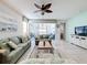 Bright and airy living room with access to the pool and patio at 1812 Sandy Park Trl, Kissimmee, FL 34747