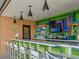 Relaxing pool bar with seating and a TV at 1812 Sandy Park Trl, Kissimmee, FL 34747