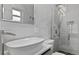 Modern bathroom with marble tile, a large walk-in shower, and a floating sink at 2061 Geronimo Trl, Maitland, FL 32751