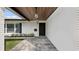 Covered entryway with a black front door and tiled flooring at 2061 Geronimo Trl, Maitland, FL 32751