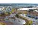 Aerial view of houses and a pond at 215 Annabelle Way, Davenport, FL 33837