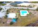 Community pool and playground with surrounding landscape at 215 Annabelle Way, Davenport, FL 33837