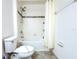 Bathroom with bathtub, toilet, and shower at 215 Annabelle Way, Davenport, FL 33837