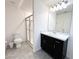 Bathroom with shower, toilet, and vanity with dark brown cabinets at 215 Annabelle Way, Davenport, FL 33837