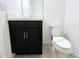 Small half bathroom with toilet and vanity at 215 Annabelle Way, Davenport, FL 33837