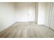 Empty bedroom with carpeted floor and door at 215 Annabelle Way, Davenport, FL 33837