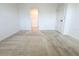 Bedroom with carpet, closet, and access to another room at 215 Annabelle Way, Davenport, FL 33837