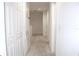 Upstairs hallway with carpet and multiple doors at 215 Annabelle Way, Davenport, FL 33837