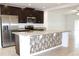 Spacious kitchen with island and stainless steel appliances at 215 Annabelle Way, Davenport, FL 33837