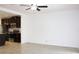 Open living room with ceiling fan and view of kitchen at 215 Annabelle Way, Davenport, FL 33837
