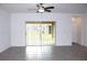 Living room with sliding glass doors leading to backyard at 215 Annabelle Way, Davenport, FL 33837