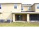 Ground level patio with sliding glass doors at 215 Annabelle Way, Davenport, FL 33837
