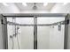 Shower stall with tiled walls and glass enclosure at 215 Annabelle Way, Davenport, FL 33837