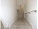 Carpeted staircase leading to lower level at 215 Annabelle Way, Davenport, FL 33837