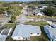 Aerial view of a house and neighborhood, near the water at 219 Macon Way, St Cloud, FL 34769