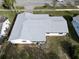 House with gray roof, showing backyard and part of street at 219 Macon Way, St Cloud, FL 34769