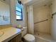 Bathroom with shower, toilet, and vanity at 219 Macon Way, St Cloud, FL 34769