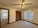 Well-lit bedroom with built-in closet and view of hallway at 219 Macon Way, St Cloud, FL 34769